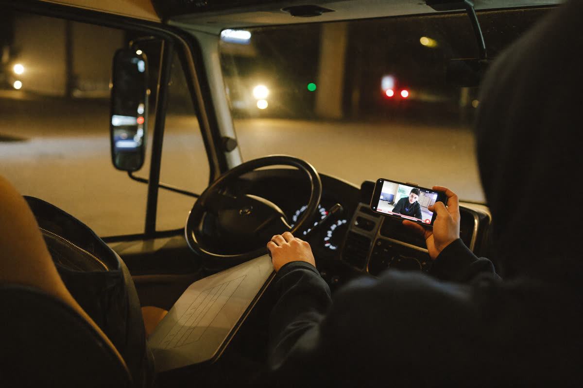 AI-generated photo: a driver on a video call with a recruiter from his truck cab
